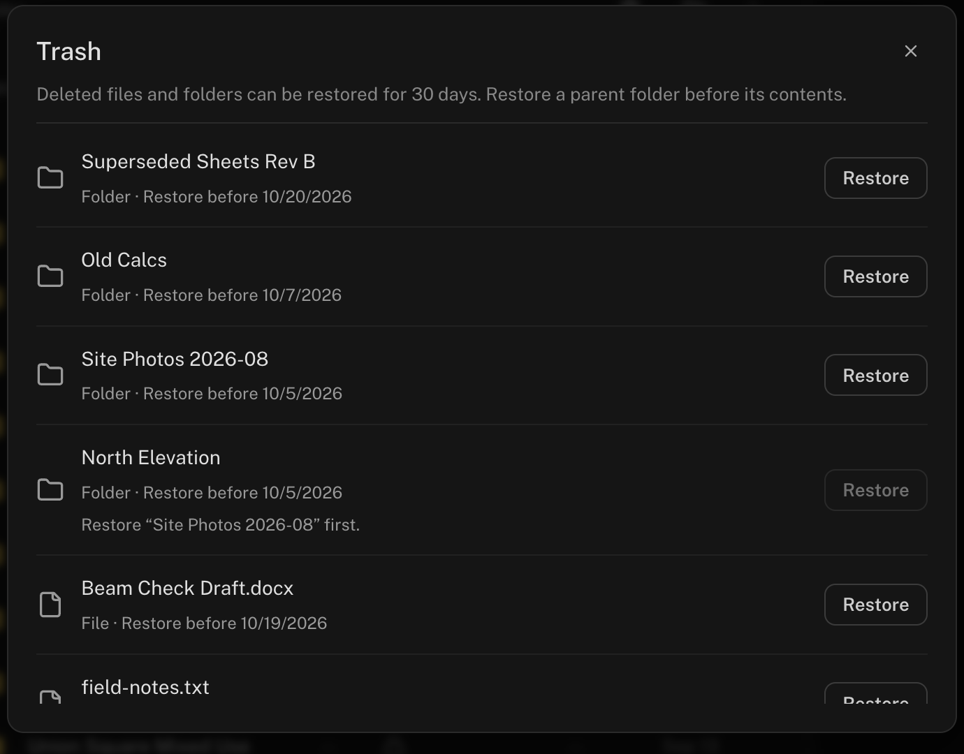The Trash dialog listing deleted files and folders with Restore buttons